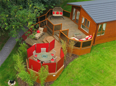 AB Sundecks Decking and Steel Red Glass on Lodge with an array of tables, chairs and sunbeds