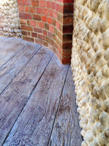 AB Sundecks Decking and Picket Glass in garden surrounding trees with Hot Tub in center